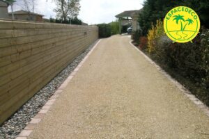 gravier compacté et pavé bordure posé sur béton Cugnaux